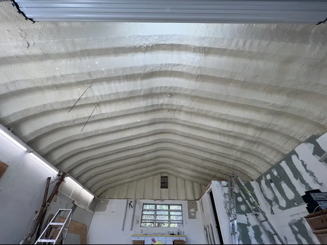 Spray polyurethane foam applied to the underside of a metal roof deck in Westminster